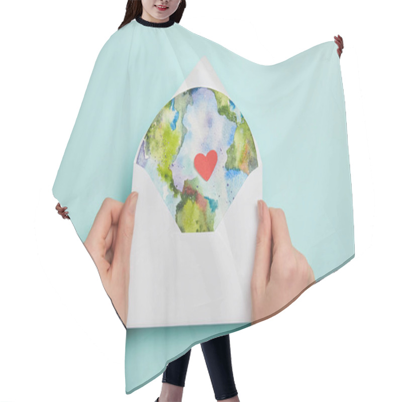 Personality  Top View Of Woman Holding Envelope With Planet Picture On Turquoise Background, Earth Day Concept Hair Cutting Cape