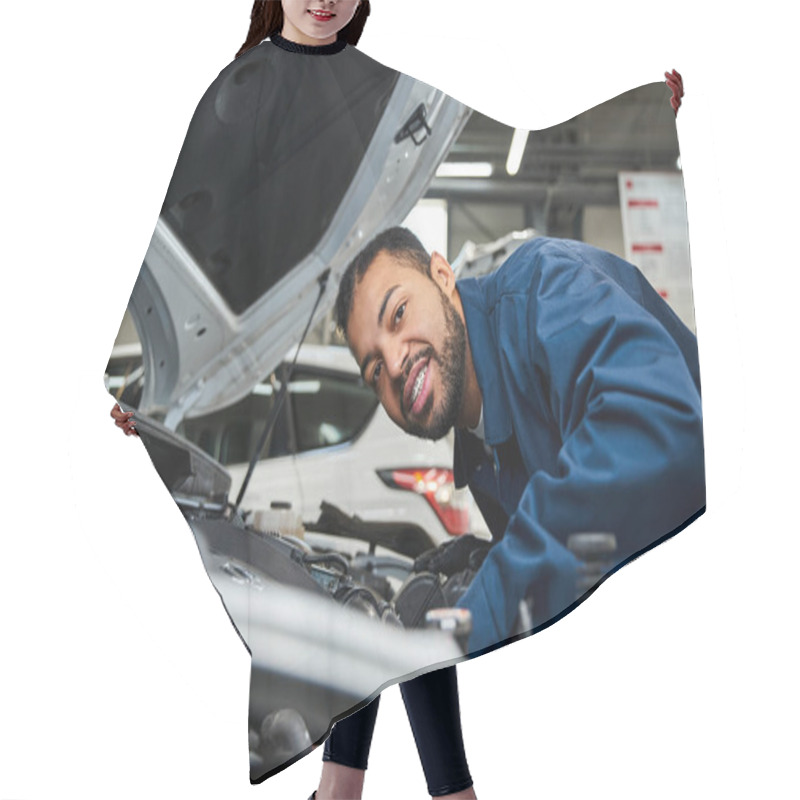 Personality  A Young Mechanic Smiles While Expertly Fixing A Car Engine Under Bright Workshop Lights. Hair Cutting Cape