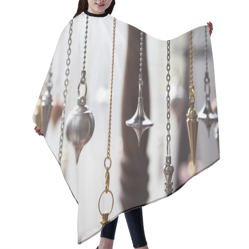 Personality  Pendulums being used for the exercise of the trade of healer dowser and magnetizer. hair cutting cape