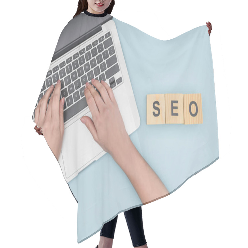 Personality  Top View Of Woman Typing On Laptop Keyboard On Light Blue Background  Hair Cutting Cape