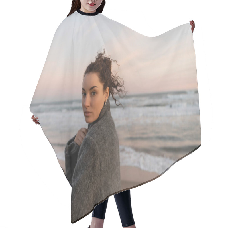 Personality  Portrait Of Curly Woman Looking At Camera On Beach In Spain  Hair Cutting Cape