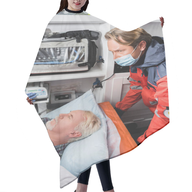 Personality  Selective Focus Of Paramedic In Medical Mask Standing Near Doctor Examining Elderly Patient With Stethoscope In Ambulance Car   Hair Cutting Cape