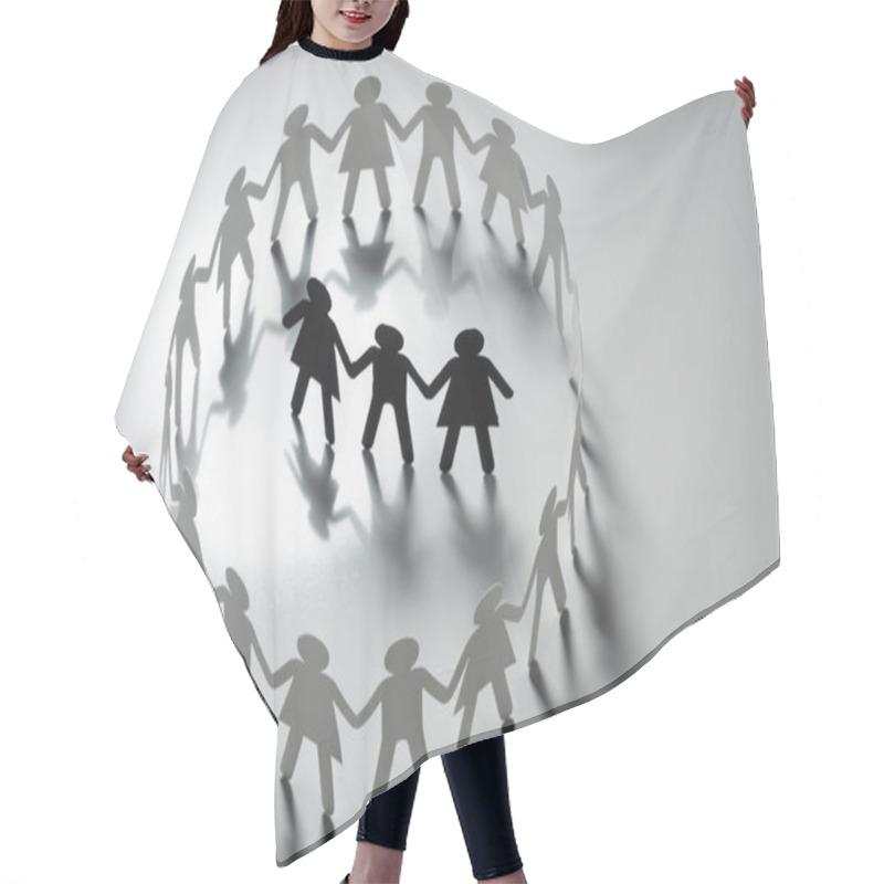 Personality  Three Human Paper Figures Surrounded By Circle Of Paper People Holding Hands On White Surface. Bulling, Segregation, Conflict Concept. Hair Cutting Cape