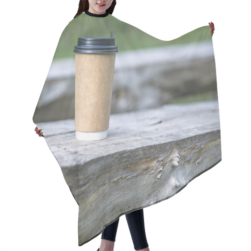 Personality  Close-up Paper Cup Of Coffee On Natural Background On A Wooden Bench. For A Coffee Shop. Hair Cutting Cape