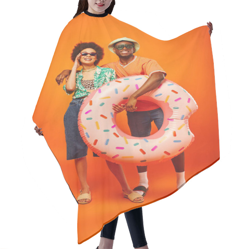 Personality  Full Length Of Smiling Young African American Man In Sunglasses And Panama Hat Hugging Stylish Best Friend And Holding Swim Ring On Orange Background, Friends In Trendy Casual Attire Hair Cutting Cape