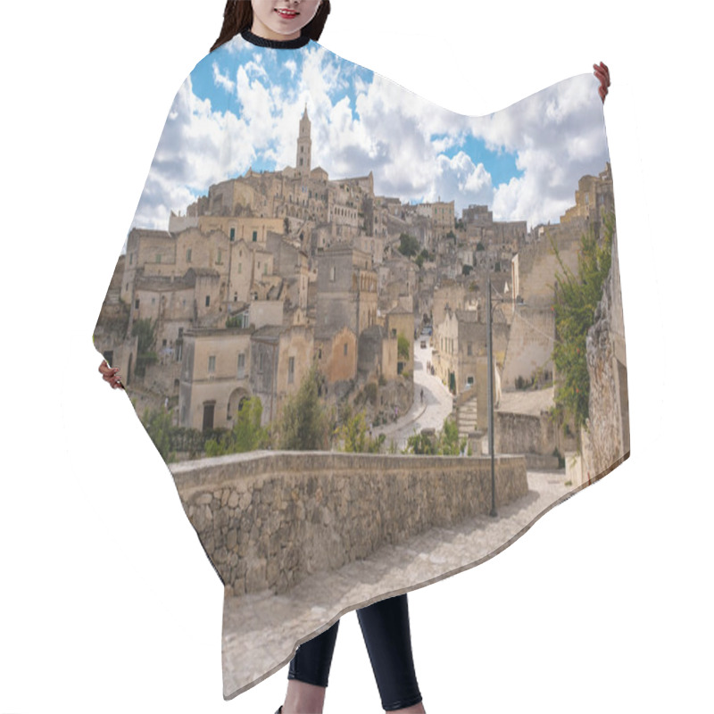 Personality  Wandering Through The Historic Alleys Of Matera In Puglia, Italy, Where Ancient Stone Buildings Rise Against A Stunning Sky Adorned With Fluffy Clouds. Hair Cutting Cape