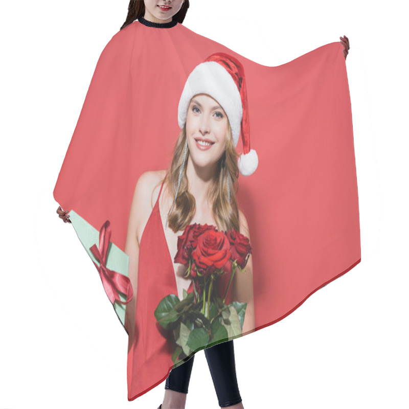 Personality  Cheerful Woman In Santa Hat Holding Roses And Gift Box On Red Hair Cutting Cape