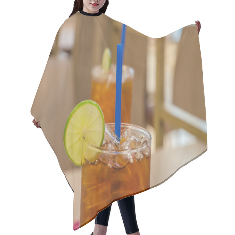 Personality  Ice Tea Lemon Iced Drink With Slices Of Lime And Ice. Hair Cutting Cape