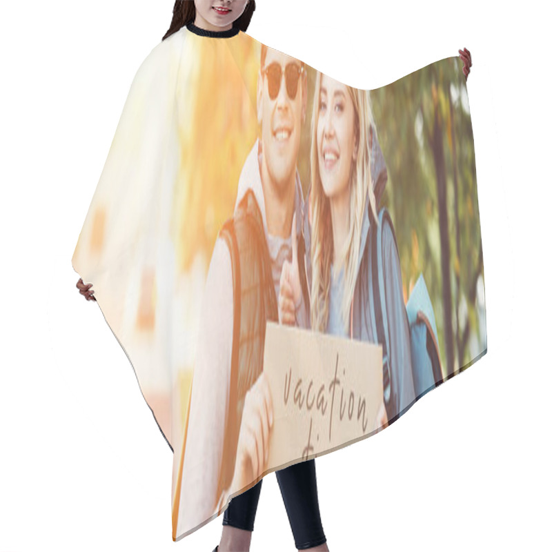 Personality  Happy Young Couple Of Travelers Holding Card With Inscription Vacation Time  Hair Cutting Cape