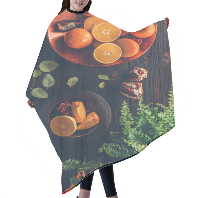 Personality  Top View Of Persimmons With Cut Oranges And Pomegranates On Plates On Wooden Table Hair Cutting Cape