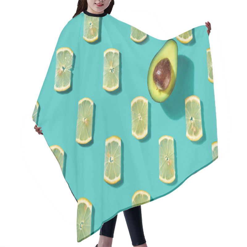 Personality  Half An Avocado And Juicy Lemon Slices On A Blue Background. Creative Food Pattern For Layout. Flat Lay Hair Cutting Cape