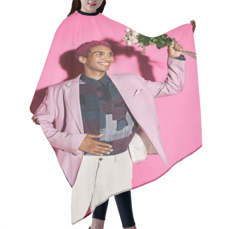 Personality  Cheerful Young Man In Pink Blazer Posing Like Doll With Rose Bouquet In Hands And Looking Away Hair Cutting Cape