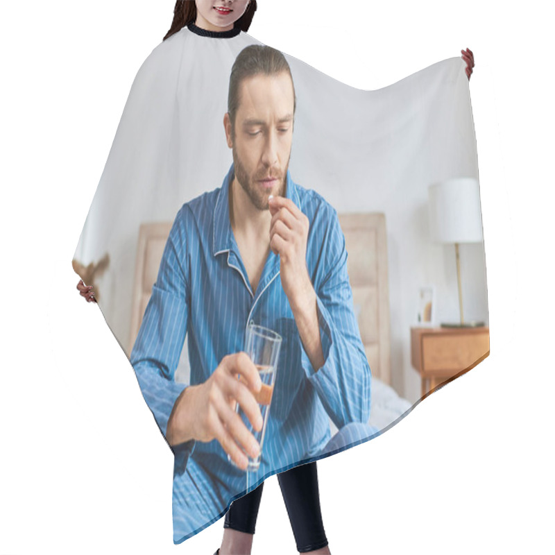 Personality  A Man Sitting On A Bed, Peacefully Drinking A Glass Of Water With Pill. Hair Cutting Cape