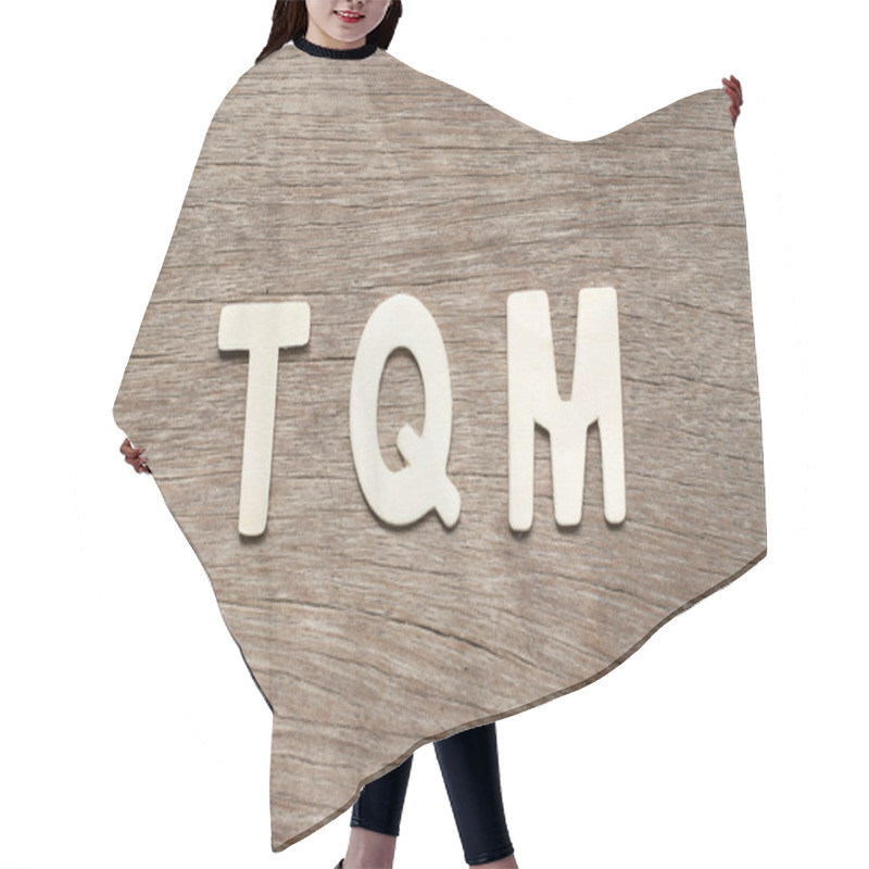 Personality  Alphabet Letter In Word TQM (Abbreviation Of Total Quality Management) On Wood Background Hair Cutting Cape