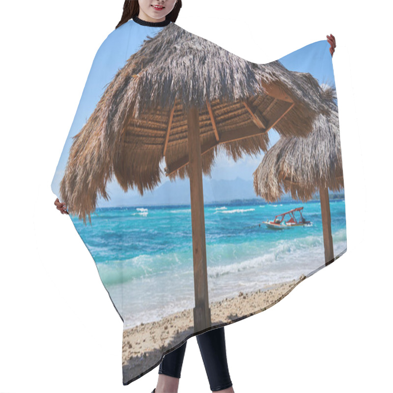 Personality  Several Thatched Beach Umbrellas Against The Backdrop Of A Turquoise Ocean On A Clear Sunny Day. Empty  Sandy Beach With Straw Parasol At The Coast On The Paradise Tropical Island. Travel Concept.  Hair Cutting Cape