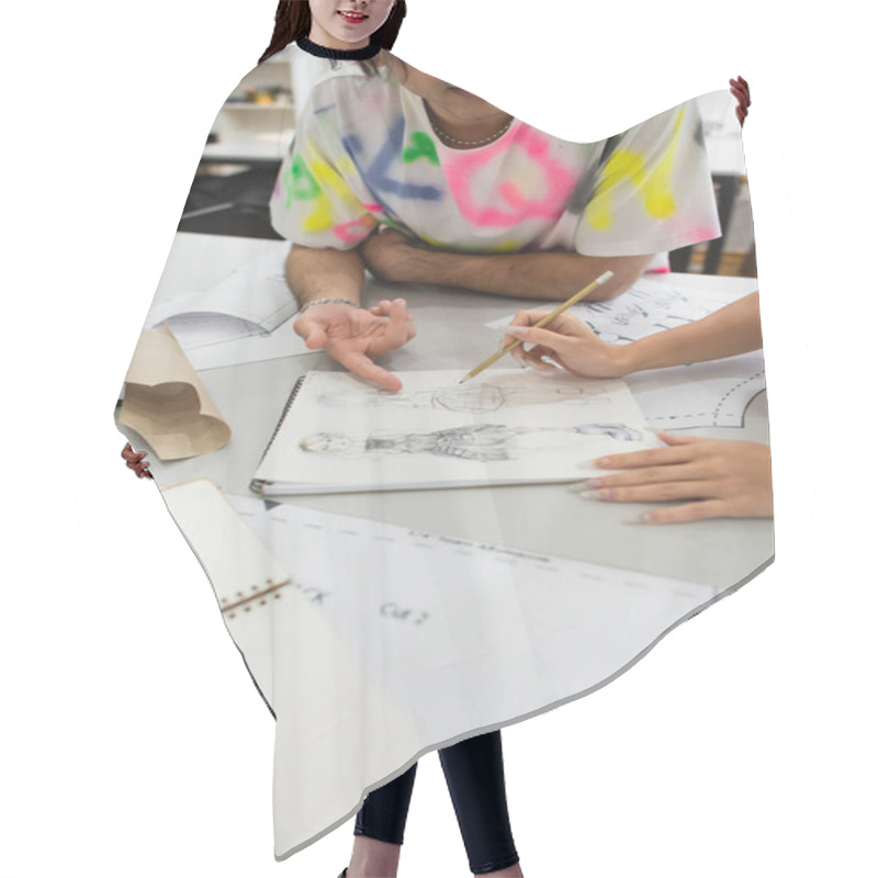 Personality  Cropped View Of Designer Pointing At Drawing Near Colleague Holding Pencil Hair Cutting Cape