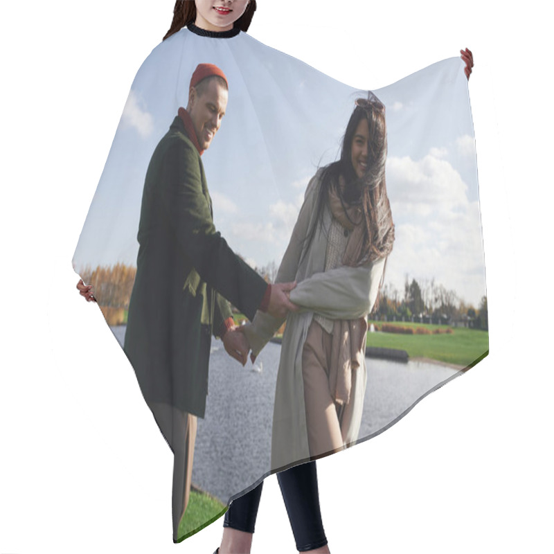 Personality  Two People Share Laughter And Joy While Holding Hands Near A Peaceful Lake On An Autumn Day. Hair Cutting Cape