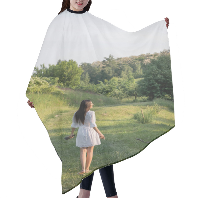 Personality  Back View Of Brunette Woman In White Dress Standing On Rural Road Near Forest Hair Cutting Cape