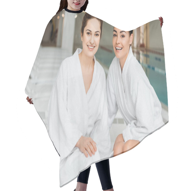 Personality  Happy Young Women In Bathrobes Smiling At Camera While Relaxing Together In Spa Hair Cutting Cape