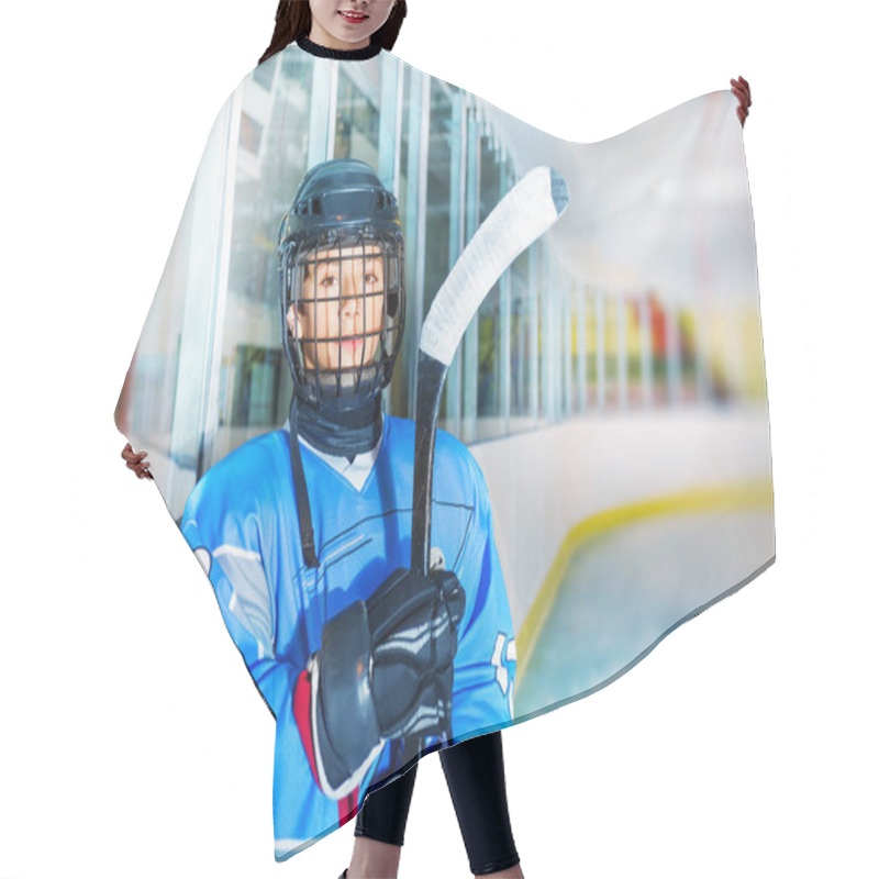 Personality  Portrait Of Young Hockey Player In Protective Equipment, Standing On Ice Rink And Looking At Camera Hair Cutting Cape