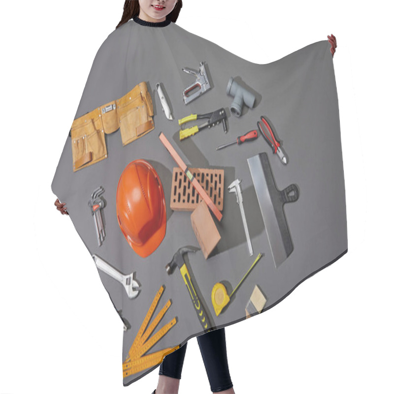 Personality  Top View Of Bricks, Tool Belt, Helmet And Industrial Tools On Grey Background Hair Cutting Cape