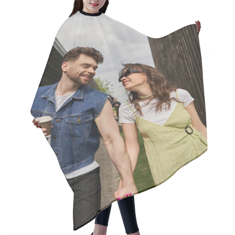 Personality  Cheerful Romantic Couple In Stylish Summer Outfits Holding Hands And Coffee To Go While Talking And Walking Between Wooden Houses In Rural Setting At Background, Outdoor Enjoyment Concept Hair Cutting Cape