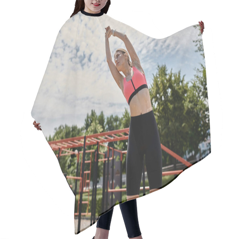 Personality  A Young Woman With Vitiligo Stretches Her Arms Above Her Head While Wearing A Pink Crop Top And Black Shorts In An Outdoor Park Setting. Hair Cutting Cape