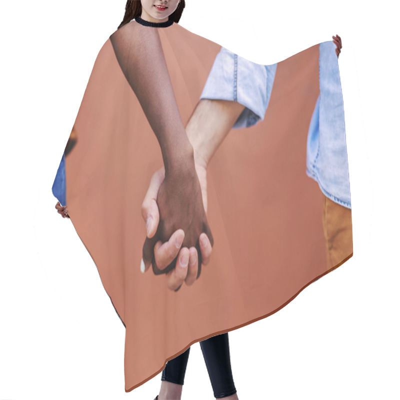 Personality  Closeup Of Multicultural Couple Holding Hands. Hair Cutting Cape