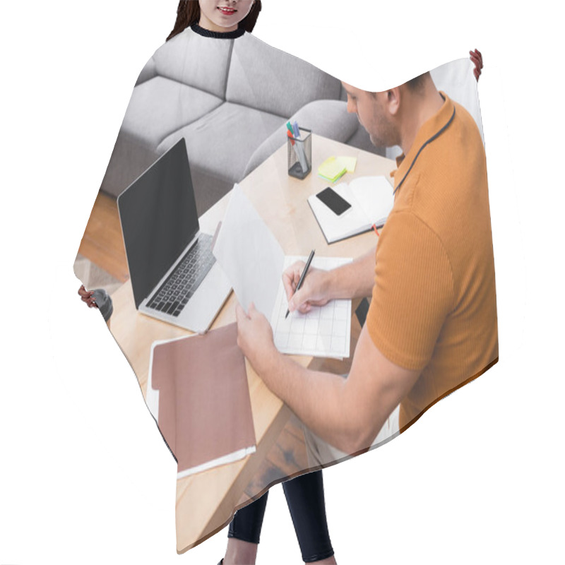 Personality  High Angle View Of Freelancer Writing In Daily Planner Near Laptop With Blank Screen Hair Cutting Cape