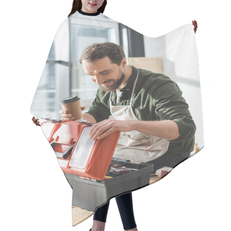 Personality  Happy Carpenter In Apron Holding Takeaway Coffee And Opening Toolbox In Workshop  Hair Cutting Cape