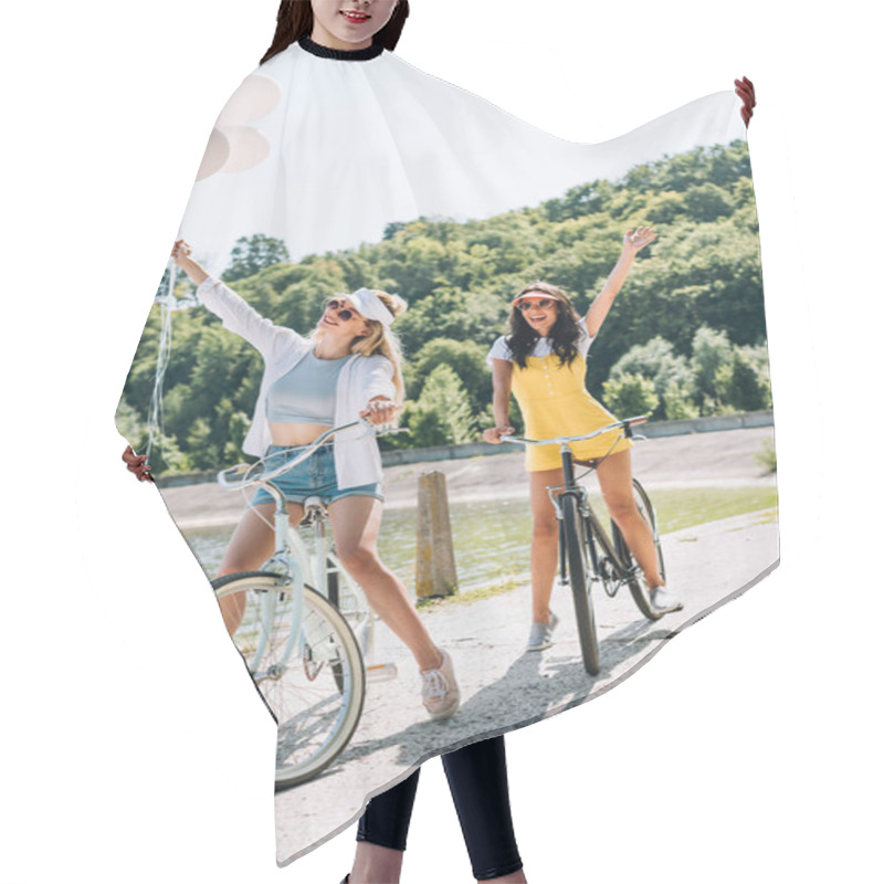 Personality  Happy Blonde And Brunette Friends Riding Bikes With Balloons Near River In Summer Hair Cutting Cape