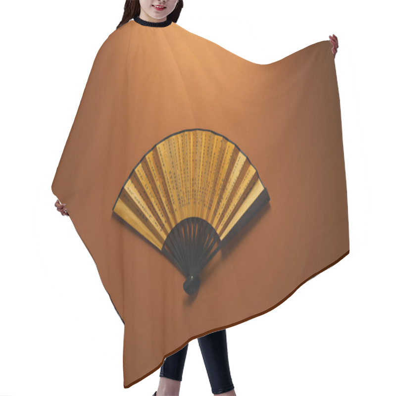 Personality  Top View Of Decorative Black And Golden Fan With Hieroglyphs On Brown Background, Chinese New Year Concept Hair Cutting Cape