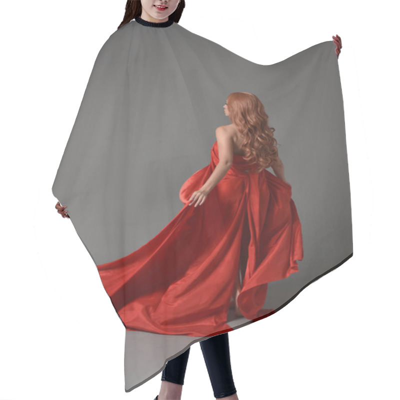 Personality  Full Length Portrait Of Woman Wearing A Red Silk Dress, Standing Pose On Grey Studio Background. Hair Cutting Cape