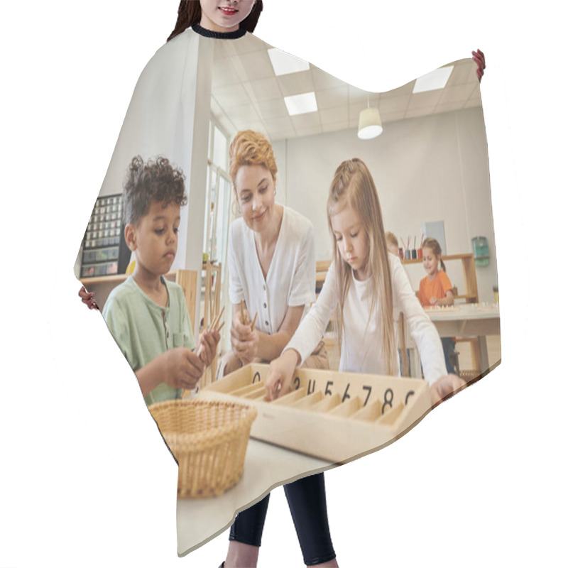 Personality  Smiling Teacher Near Interracial Kids Holding Wooden Sticks During Lesson In Montessori School Hair Cutting Cape