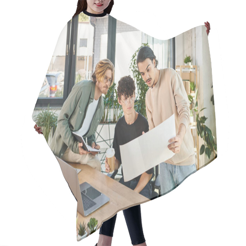 Personality  Young Man With Beard Discussing Startup Project While Showing Charts To Male Colleagues Near Laptop Hair Cutting Cape