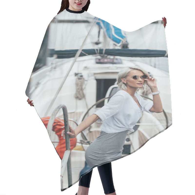 Personality  Beautiful Young Woman In Sunglasses Looking At Camera On Yacht Hair Cutting Cape