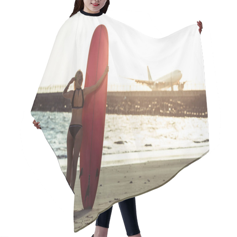 Personality  Rear View Of Female Surfer Posing With Surfboard On Beach   Hair Cutting Cape