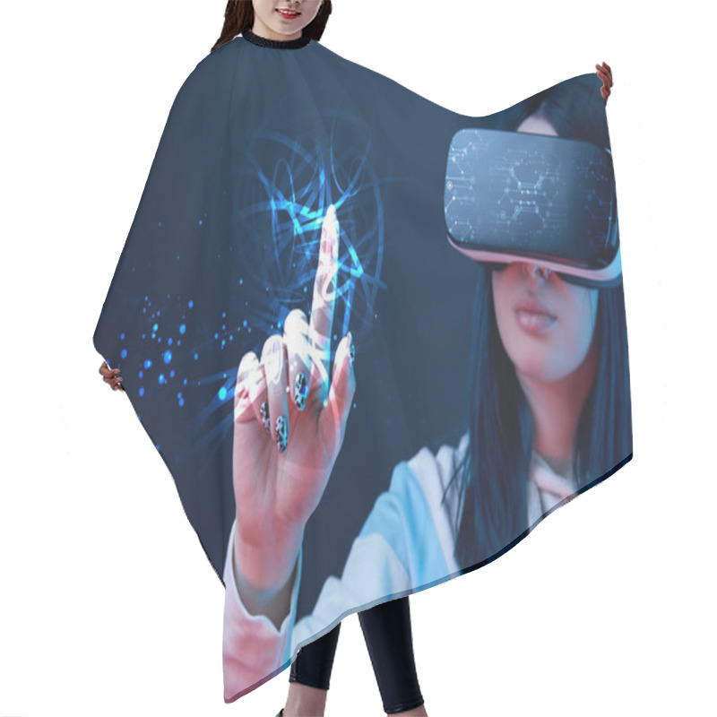 Personality  Selective Focus Of Young Woman In Virtual Reality Headset Pointing With Finger At Glowing Cyber Illustration On Dark Background Hair Cutting Cape