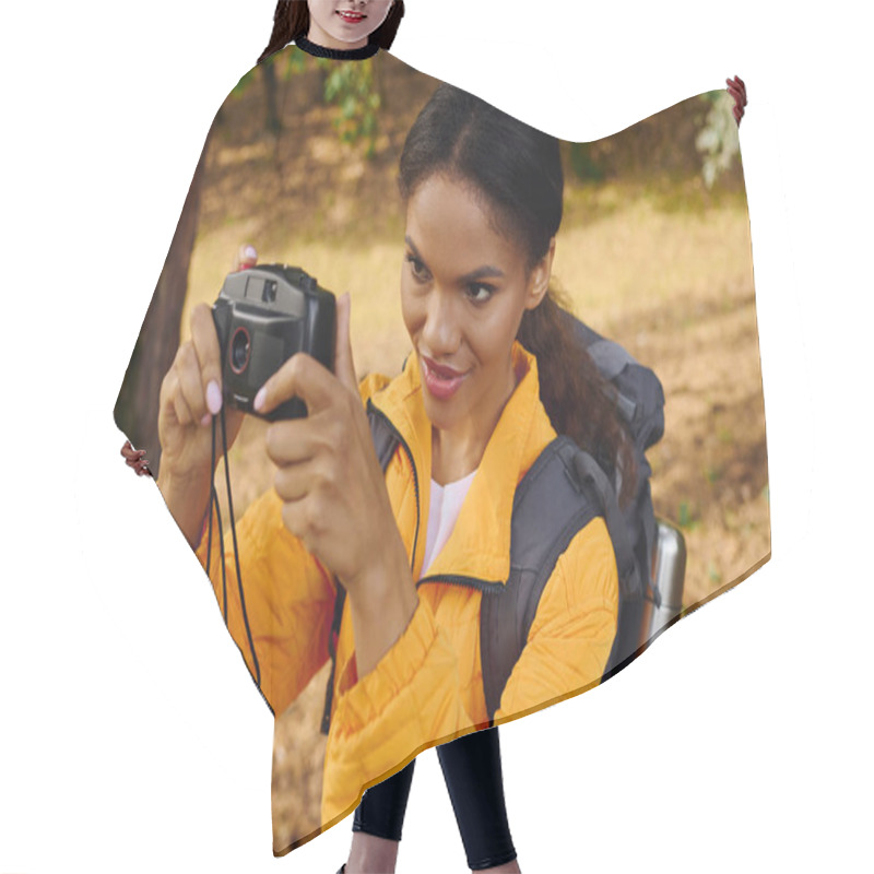 Personality  A Young African American Woman Enjoys Hiking Through An Autumn Forest, Capturing Beautiful Moments. Hair Cutting Cape