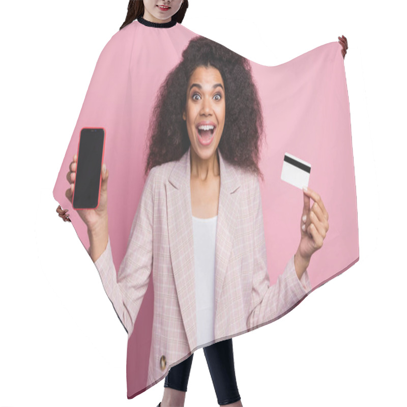 Personality  Photo Of Beautiful Excited Dark Skin Lady Hold Plastic Credit Card Showing New Model Telephone Advising Online Payment Wear Checkered Plaid Blazer Isolated Pink Pastel Color Background Hair Cutting Cape