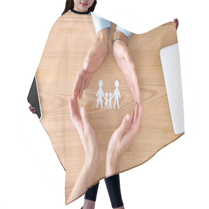 Personality  Partial View Of Insurance Agents And Female Hands With Family Paper Model On Wooden Tabletop, Family Insurance Concept Hair Cutting Cape