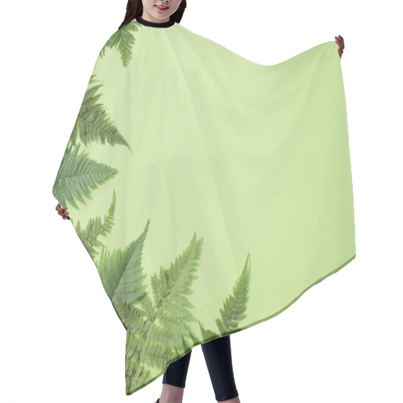 Personality  Fern Leaves Lie Around A Green Background. Horizontal Orientation Hair Cutting Cape