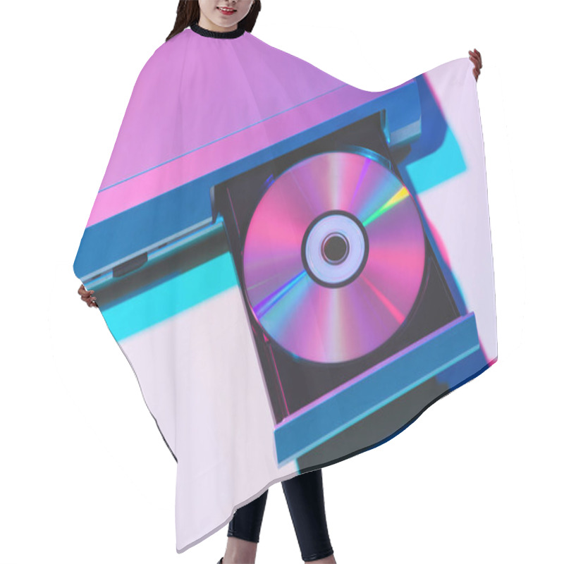 Personality  Close Up View Of Dvd Player With Disk Hair Cutting Cape