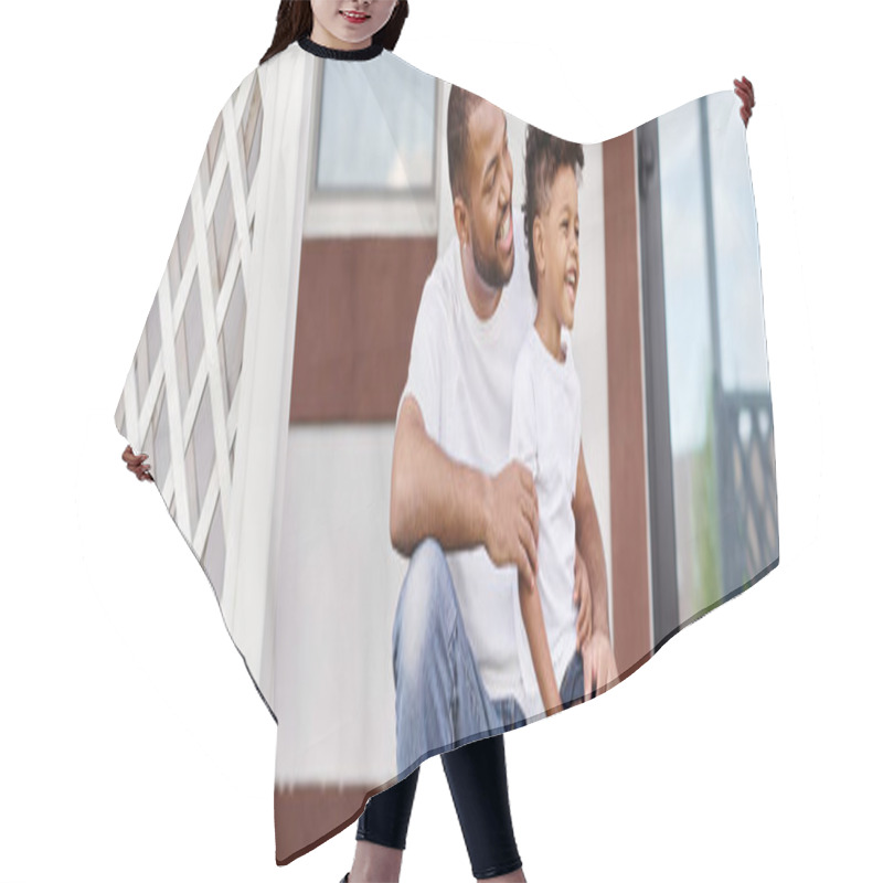 Personality  Cheerful African American Man In Braces Hugging Curly Son While Sitting On Porch Of House, Banner Hair Cutting Cape