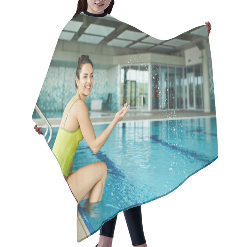 Personality  A Young Brunette Woman In A Swimsuit Sitting On The Edge Of An Indoor Swimming Pool, Finding Peace And Serenity. Hair Cutting Cape