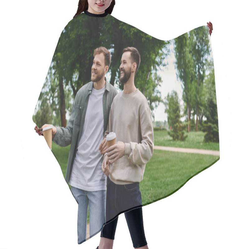 Personality  Two Bearded Men, Dressed Casually, Share A Laugh While Walking In A Park, Each Holding A Cup Of Coffee. Hair Cutting Cape