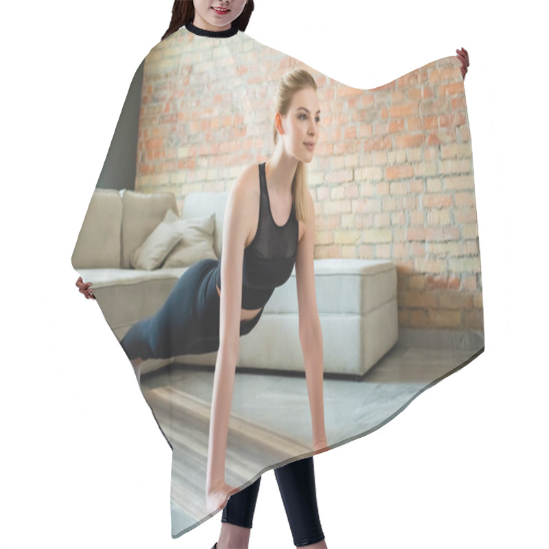 Personality  Happy Sportswoman Doing Plank Near Sports Bottle In Living Room  Hair Cutting Cape