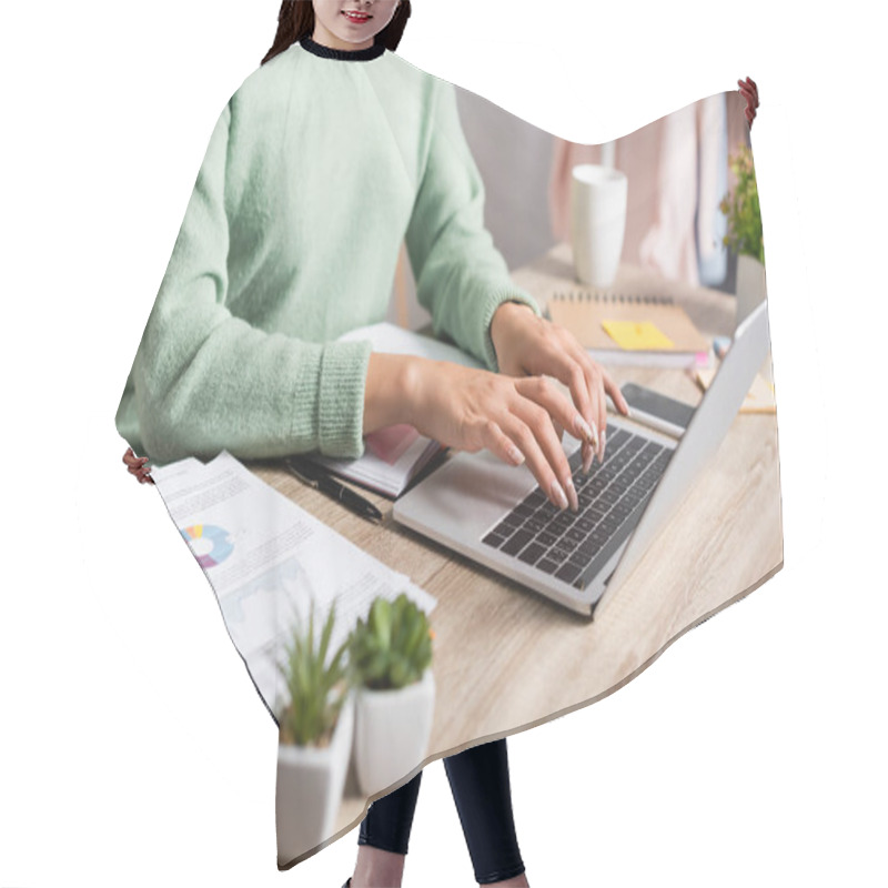 Personality  Cropped View Of Freelancer Using Laptop Near Papers With Charts On Blurred Foreground  Hair Cutting Cape