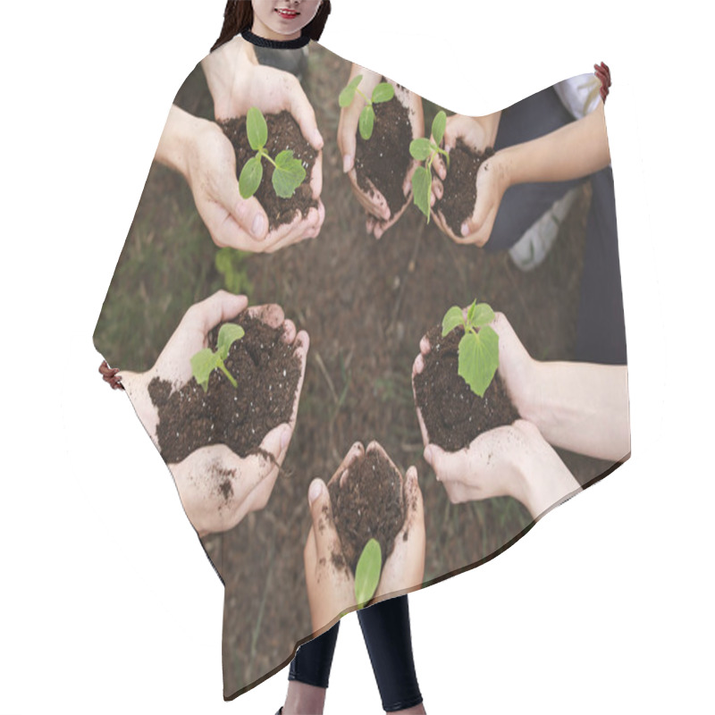 Personality  Volunteers With Young Plants Outdoors Hair Cutting Cape