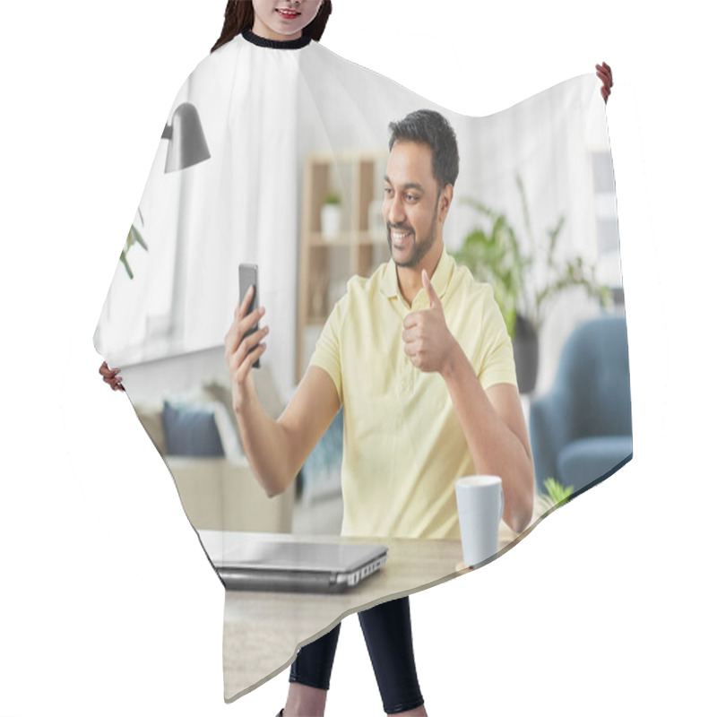 Personality  Indian Man Having Video Call On Smartphone At Home Hair Cutting Cape